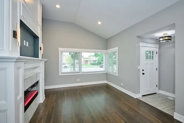 a view of livingroom with furniture flat screen tv and staircase