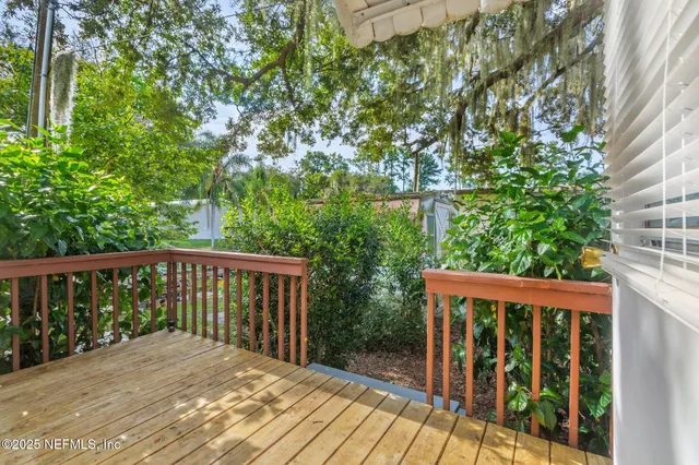 a view of a dinning table and chairs in patio of the house