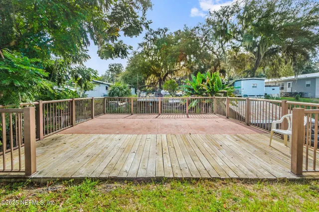 an aerial view of a house with a lake view