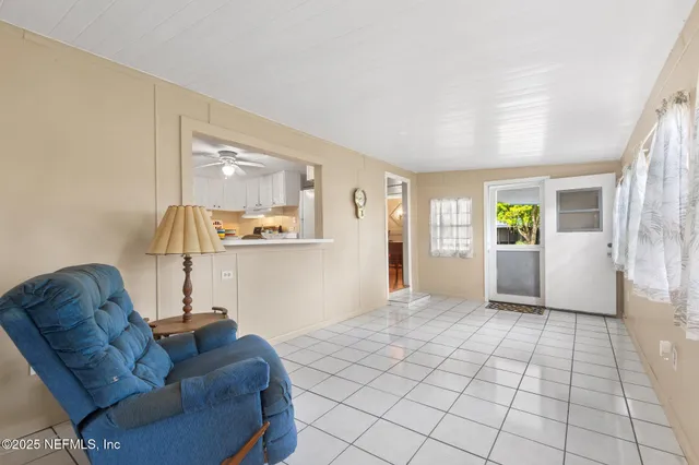 a view of an empty room with a window