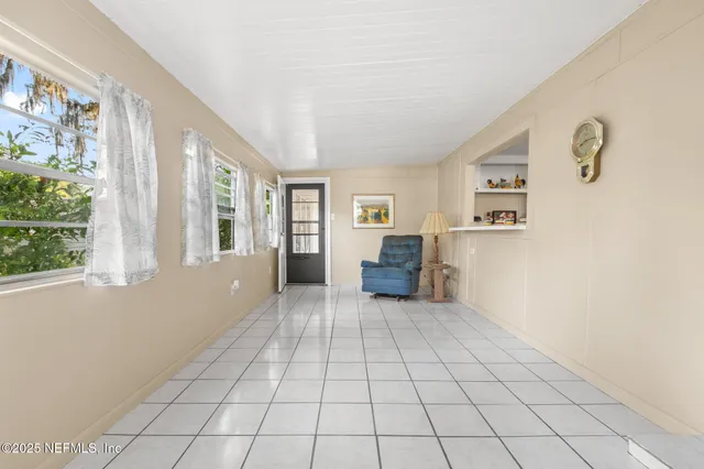 a kitchen that has a lot of cabinets and appliances