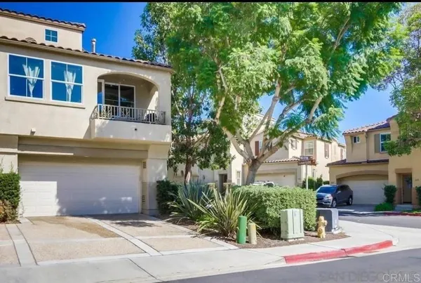 a front view of a house with yard