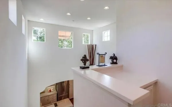 a bathroom with double sink and two mirror