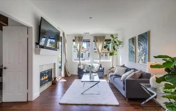 a kitchen with stainless steel appliances a refrigerator sink and microwave