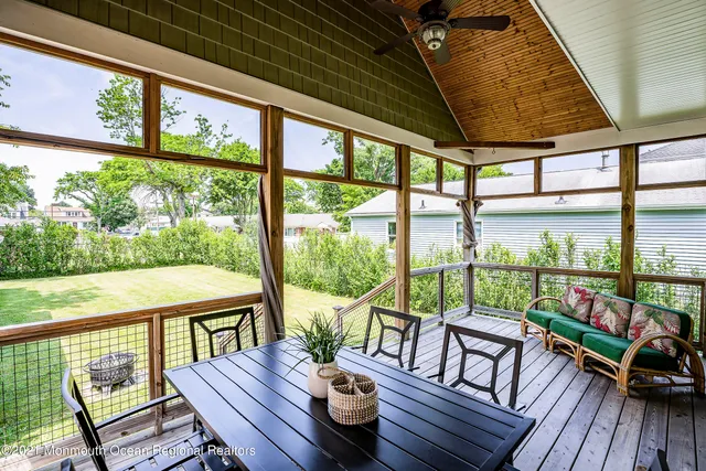 a bedroom with a bed and a ceiling fan