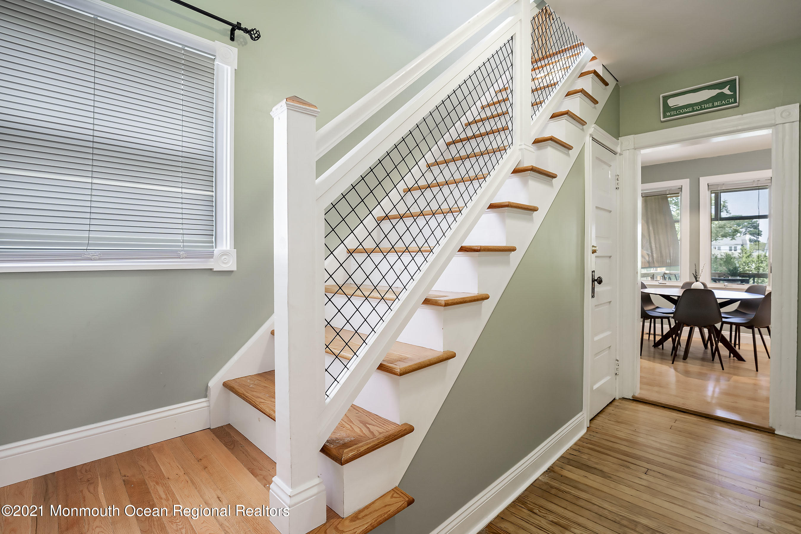 132 Sampson Place Long Branch, NJ 07740 - Photo 20 of 21 a view of entryway with wooden floor and stairs