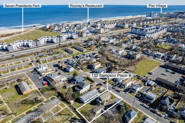 an aerial view of a building with parking space