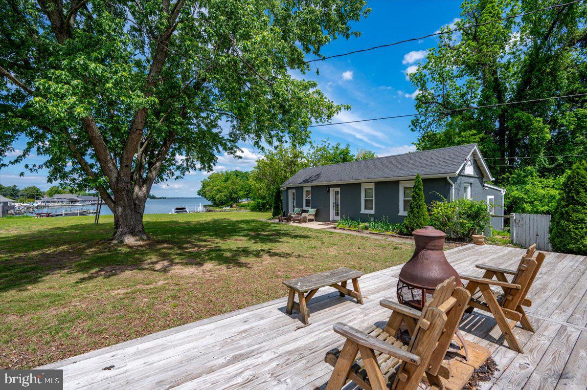 1312 Tuggies Road Pasadena, MD 21122 - Photo 17 of 75 a view of a house with a yard