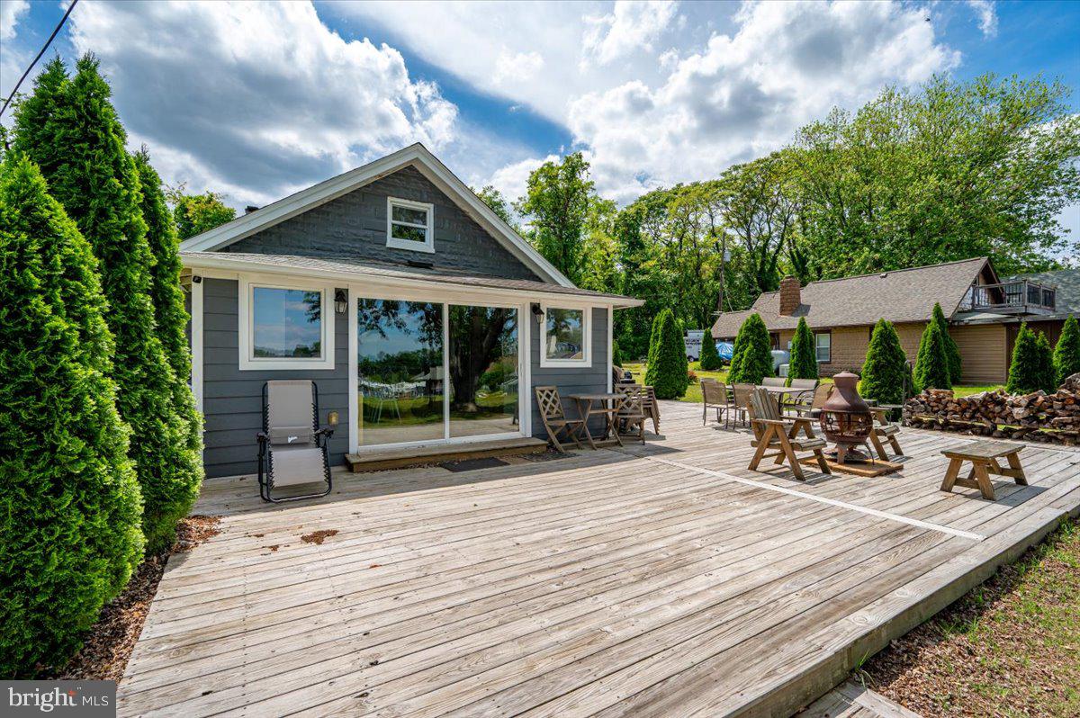 1312 Tuggies Road Pasadena, MD 21122 - Photo 19 of 75 a view of a house with sitting area and garden