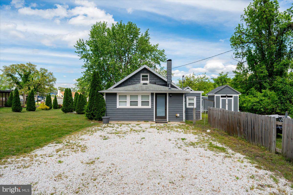 1312 Tuggies Road Pasadena, MD 21122 - Photo 2 of 75 a front view of a house with a yard