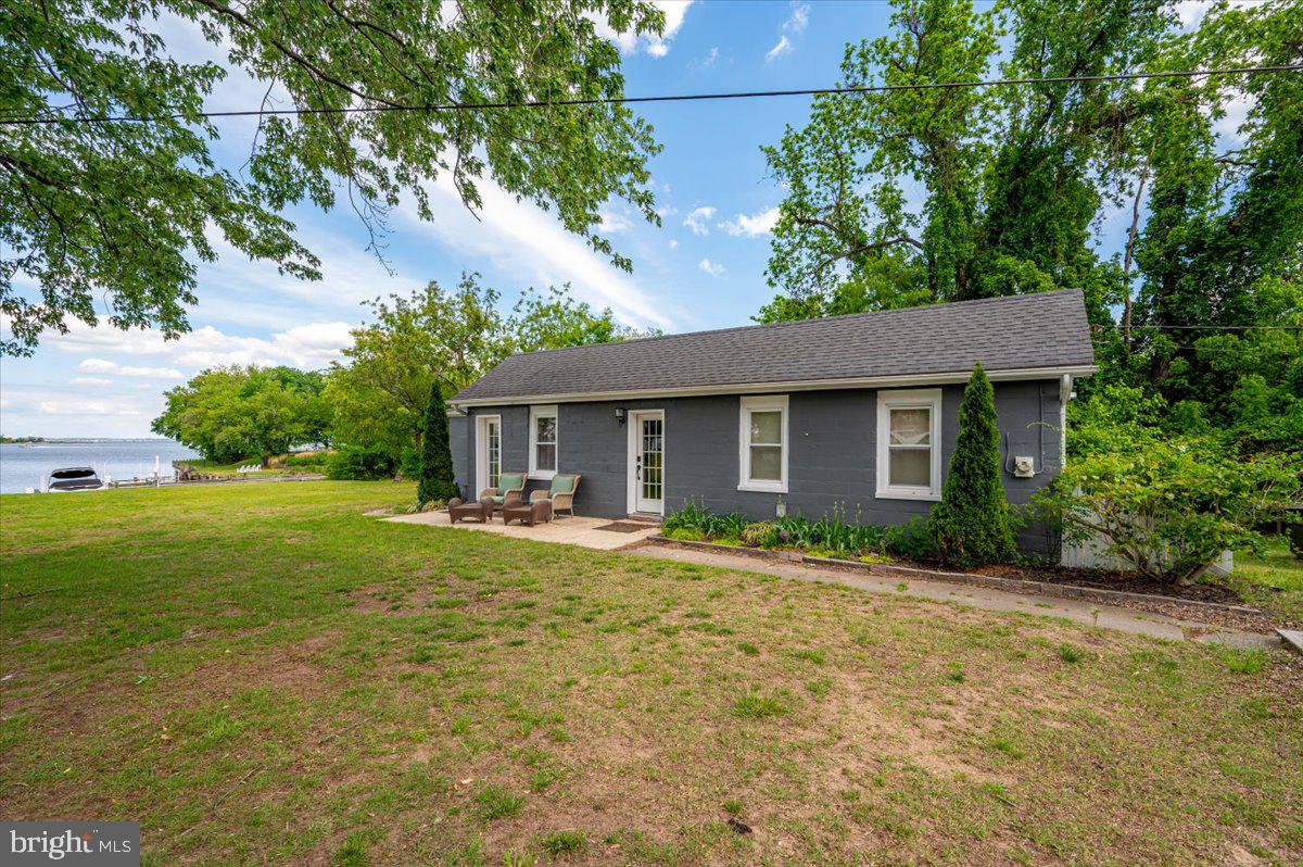 1312 Tuggies Road Pasadena, MD 21122 - Photo 21 of 75 a front view of a house with garden