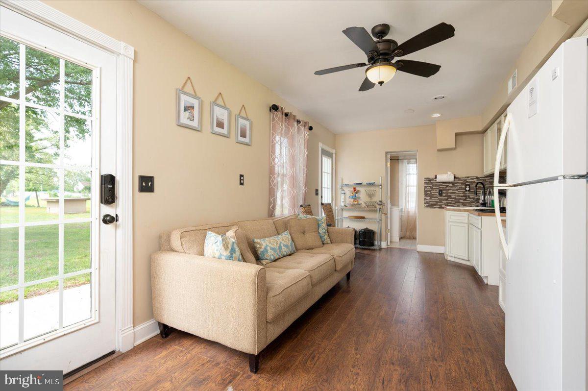 1312 Tuggies Road Pasadena, MD 21122 - Photo 24 of 75 a living room with furniture and a large window