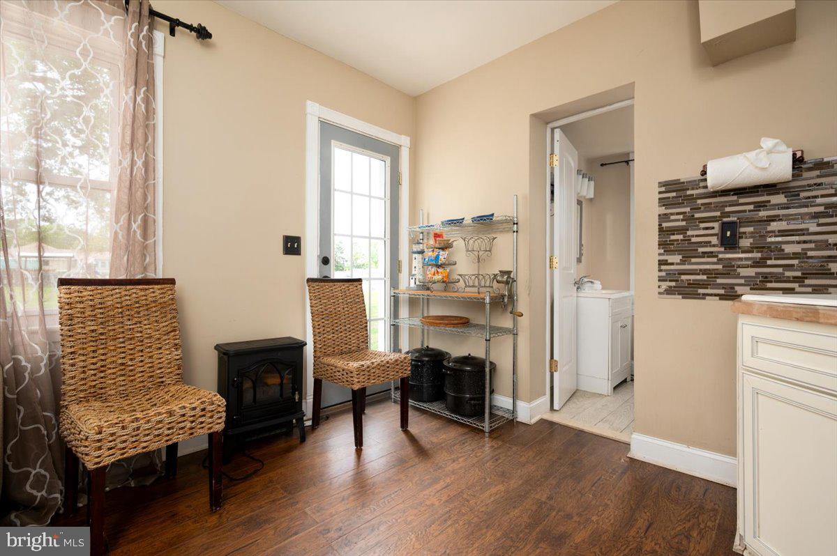 1312 Tuggies Road Pasadena, MD 21122 - Photo 26 of 75 a view of a livingroom with furniture and a floor to ceiling window