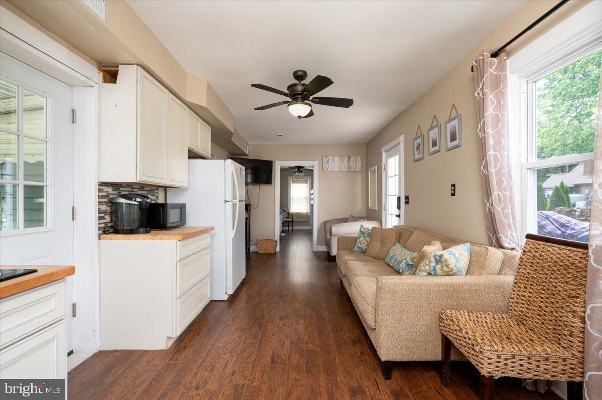 1312 Tuggies Road Pasadena, MD 21122 - Photo 30 of 75 a living room with furniture and a window