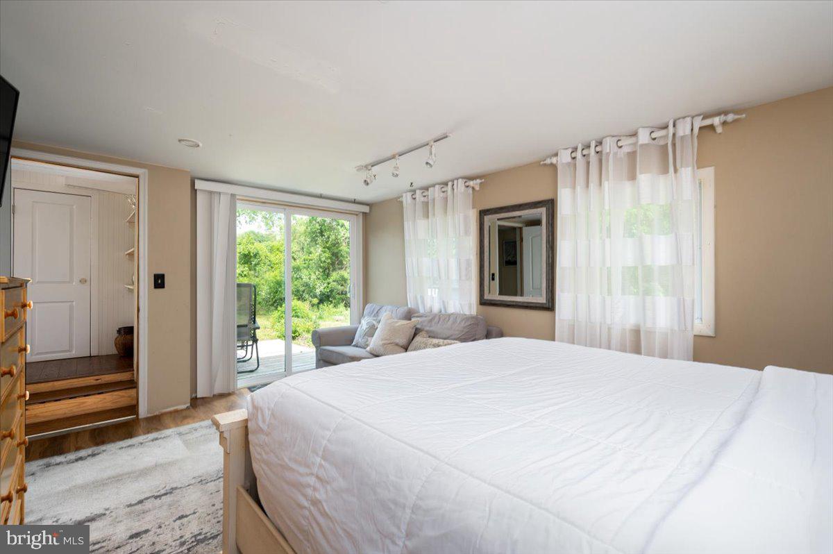 1312 Tuggies Road Pasadena, MD 21122 - Photo 37 of 75 a bedroom with a large bed and a window