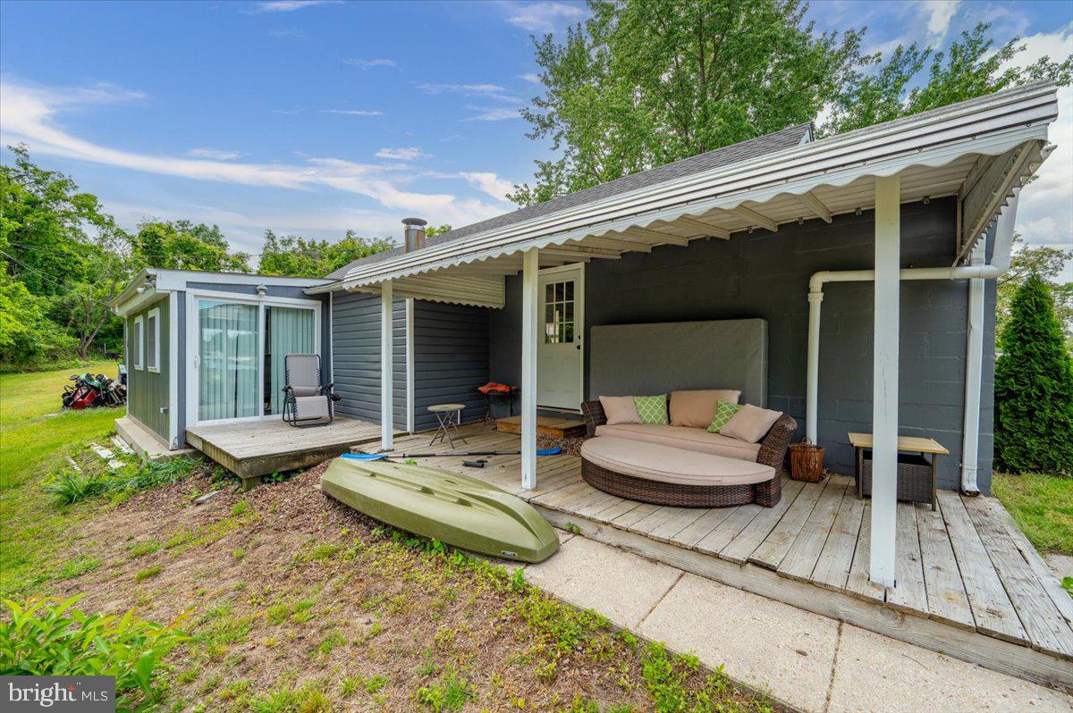 1312 Tuggies Road Pasadena, MD 21122 - Photo 39 of 75 a view of house with backyard outdoor seating and green space
