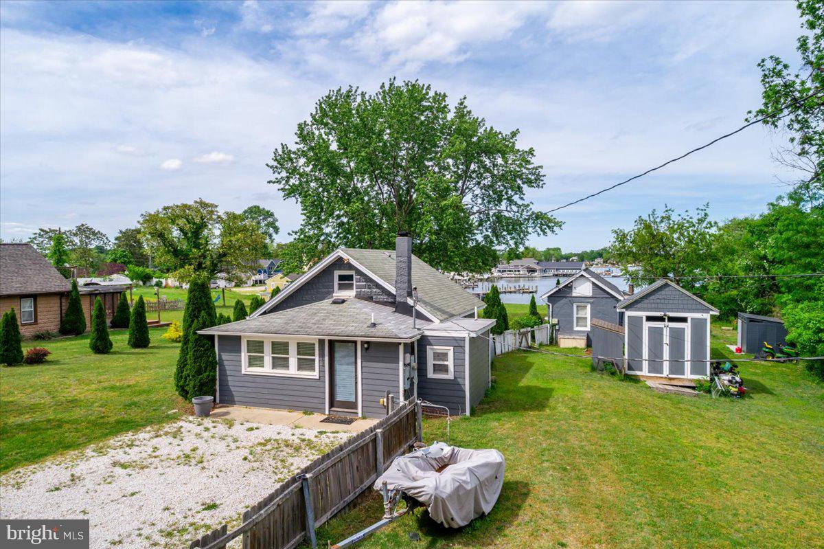 1312 Tuggies Road Pasadena, MD 21122 - Photo 51 of 75 a front view of a house with garden