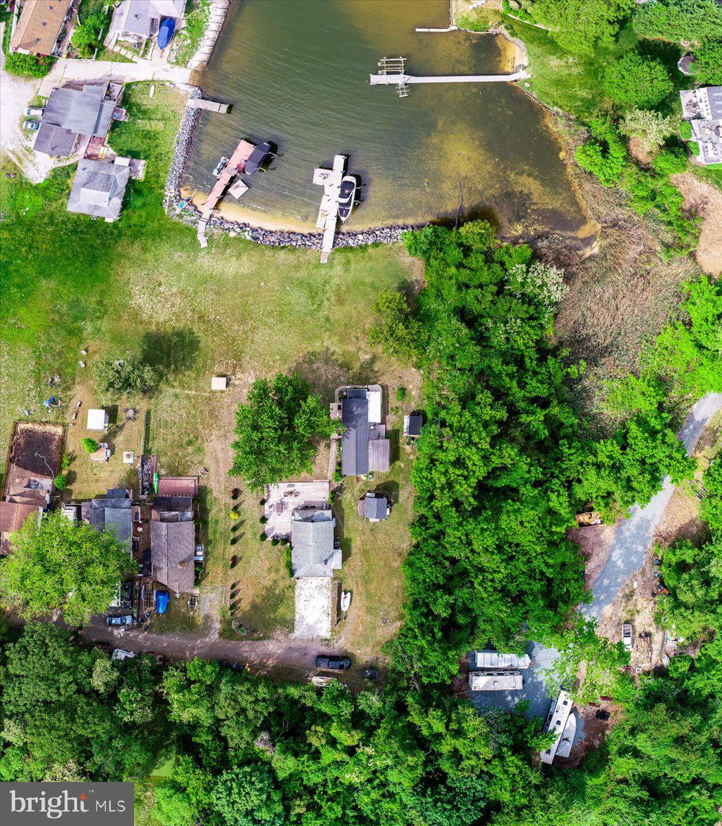 1312 Tuggies Road Pasadena, MD 21122 - Photo 53 of 75 an aerial view of residential house with outdoor space and trees all around