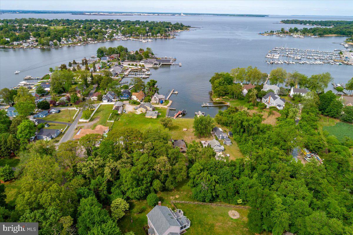 1312 Tuggies Road Pasadena, MD 21122 - Photo 59 of 75 an aerial view of a house with a lake view