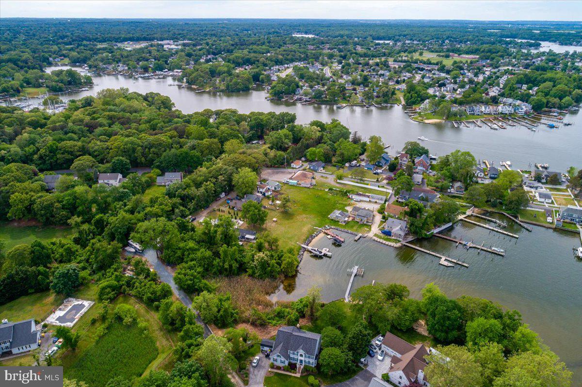 1312 Tuggies Road Pasadena, MD 21122 - Photo 61 of 75 an aerial view of a houses with a lake view