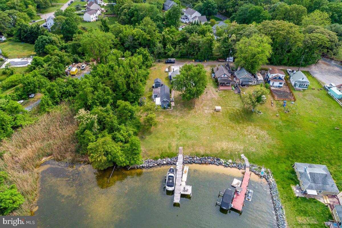 1312 Tuggies Road Pasadena, MD 21122 - Photo 69 of 75 an aerial view of a house with a lake view