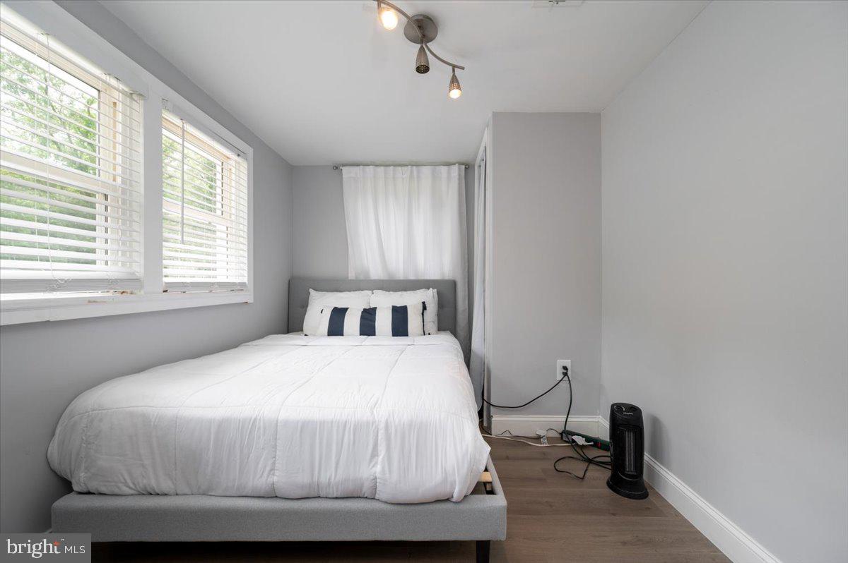 1312 Tuggies Road Pasadena, MD 21122 - Photo 7 of 75 a bedroom with a bed and a window