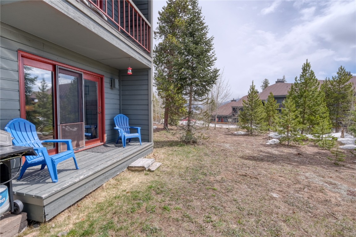 94300 Ryan Gulch Road, Unit 94302 Silverthorne, CO 80498 - Photo 22 of 33 a view of house with backyard and outdoor seating