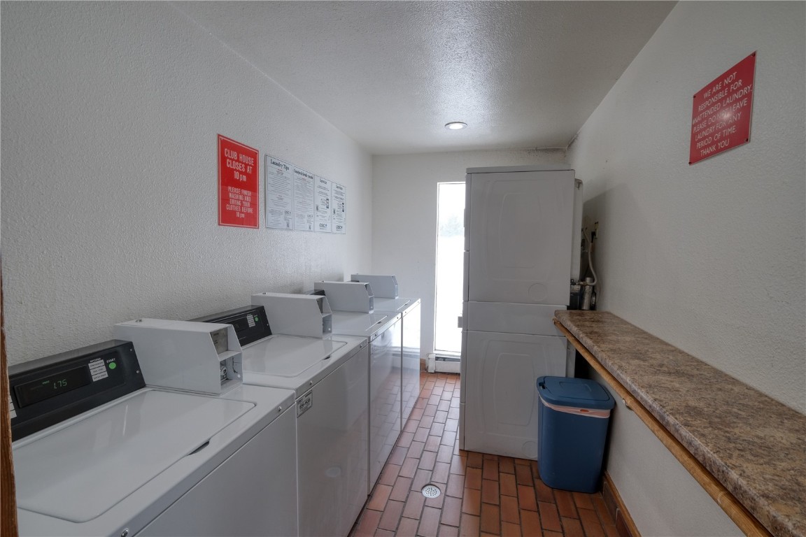 94300 Ryan Gulch Road, Unit 94302 Silverthorne, CO 80498 - Photo 24 of 33 a room with furniture and a wooden floor