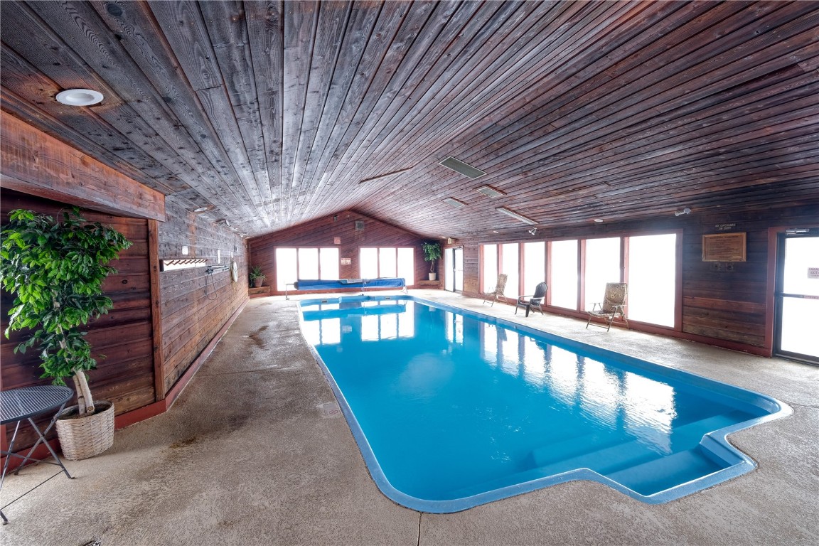 94300 Ryan Gulch Road, Unit 94302 Silverthorne, CO 80498 - Photo 26 of 33 a view of a swimming pool with a patio