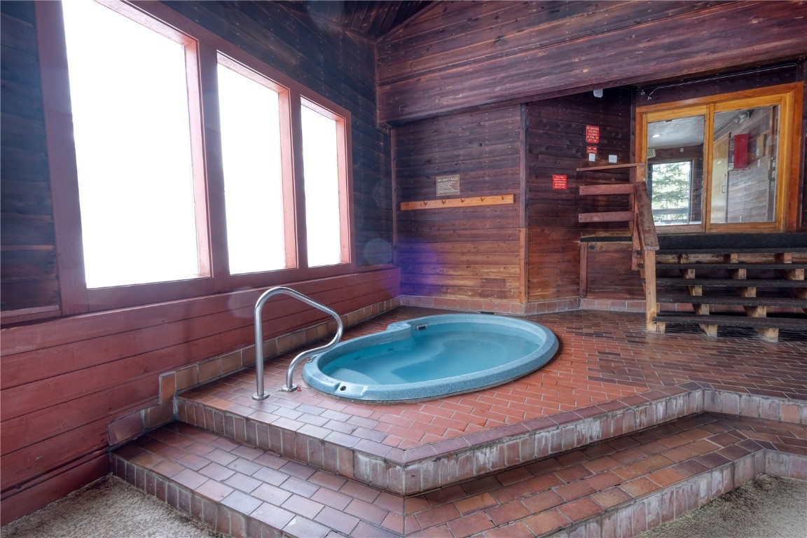 94300 Ryan Gulch Road, Unit 94302 Silverthorne, CO 80498 - Photo 28 of 33 a room with furniture and window