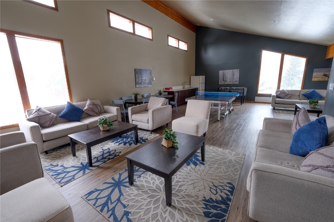 94300 Ryan Gulch Road, Unit 94302 Silverthorne, CO 80498 - Photo 29 of 33 a living room with furniture and a large window