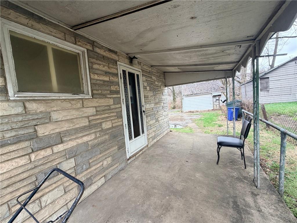 408 Simms Street Pittsburgh, PA 15211 - Photo 12 of 15 a view of front door and porch with seating