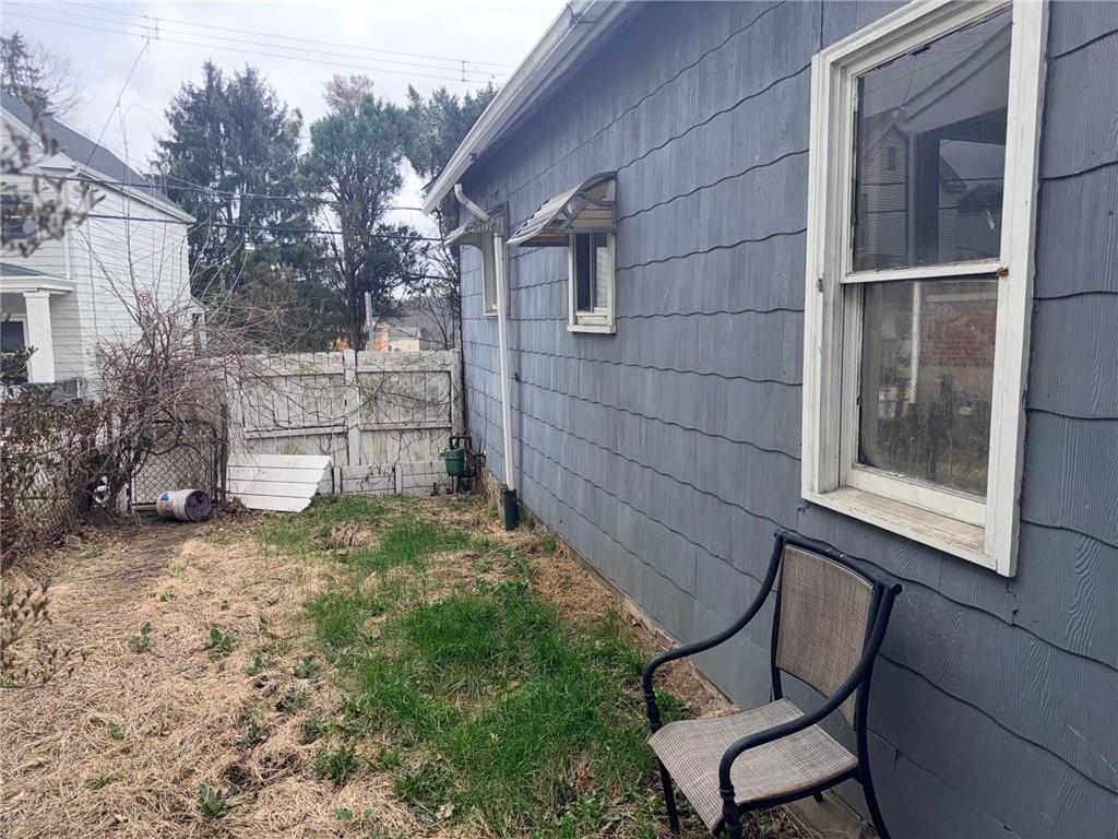 408 Simms Street Pittsburgh, PA 15211 - Photo 13 of 15 a backyard of a house with table and chairs