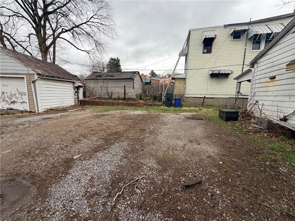 408 Simms Street Pittsburgh, PA 15211 - Photo 14 of 15 a view of a house with a yard