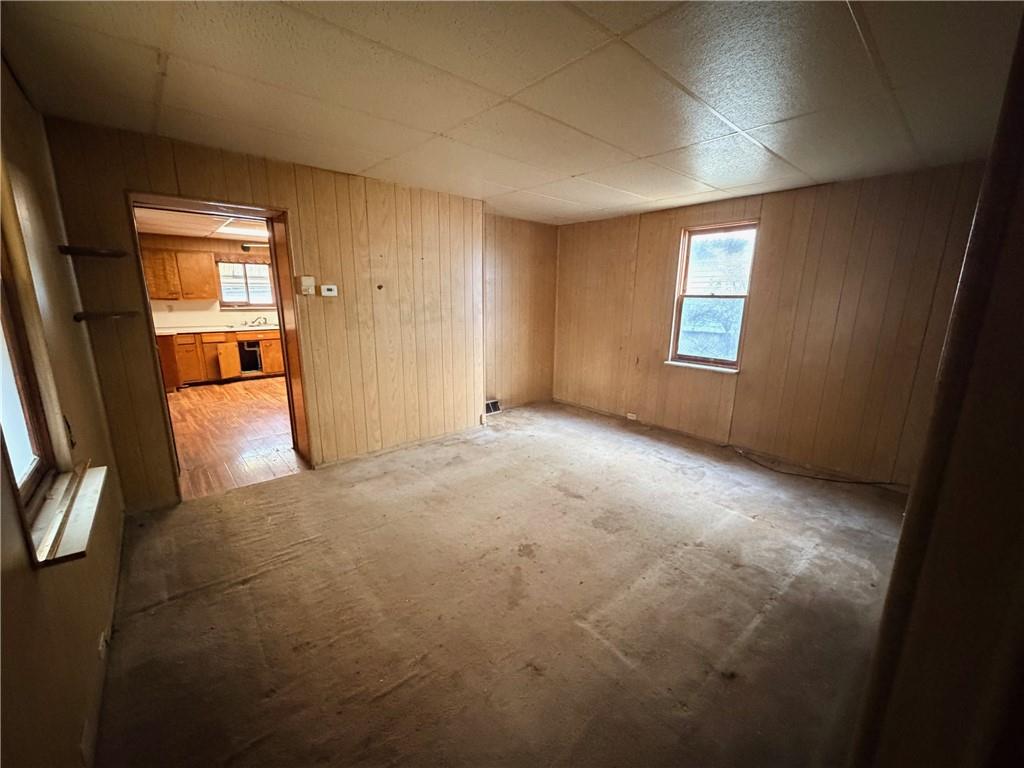 408 Simms Street Pittsburgh, PA 15211 - Photo 4 of 15 a view of a livingroom with an empty space and a window