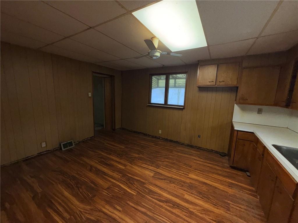 408 Simms Street Pittsburgh, PA 15211 - Photo 6 of 15 a view of an empty room with wooden floor and a window