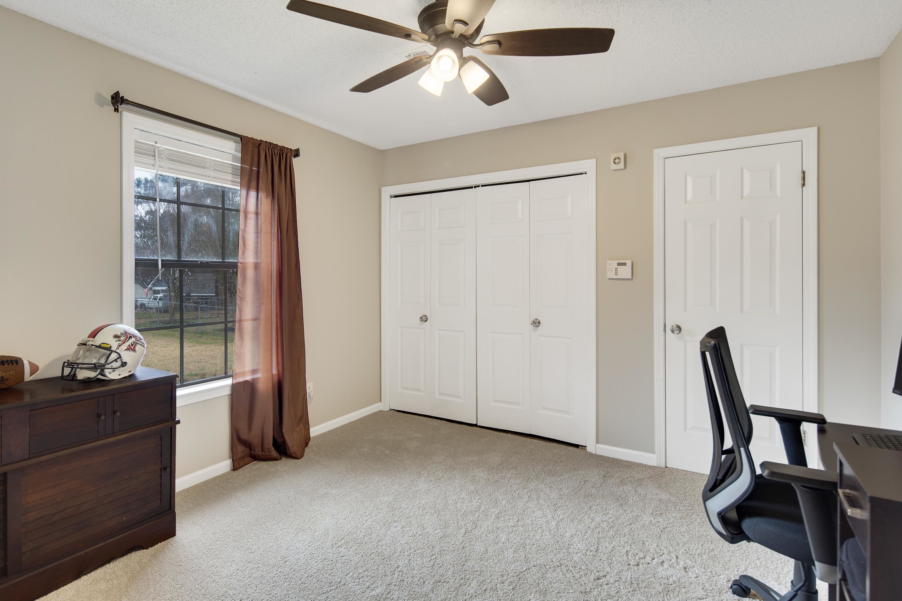 411 Shelton Road Collierville, TN 38017 - Photo 16 of 19 a view of a workspace with furniture and a window