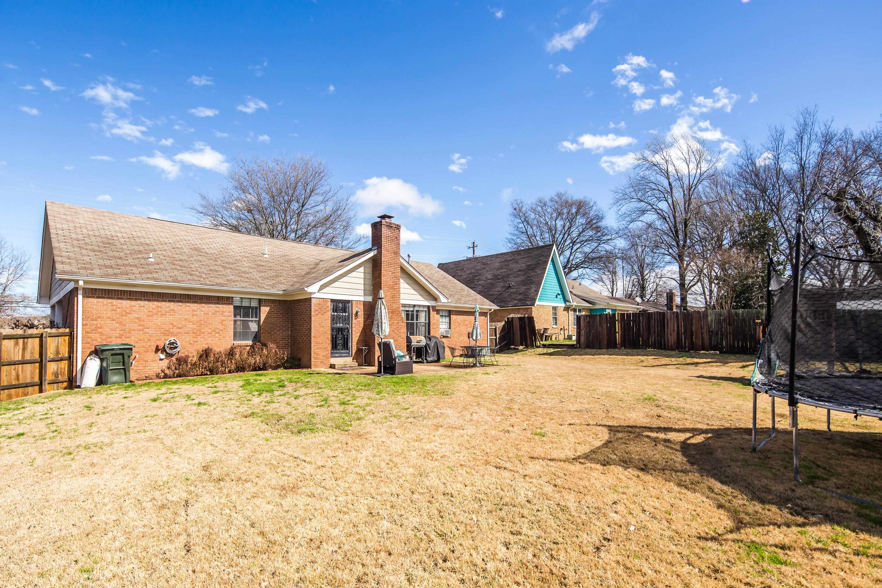 411 Shelton Road Collierville, TN 38017 - Photo 17 of 19 a view of a house with a yard covered in snow