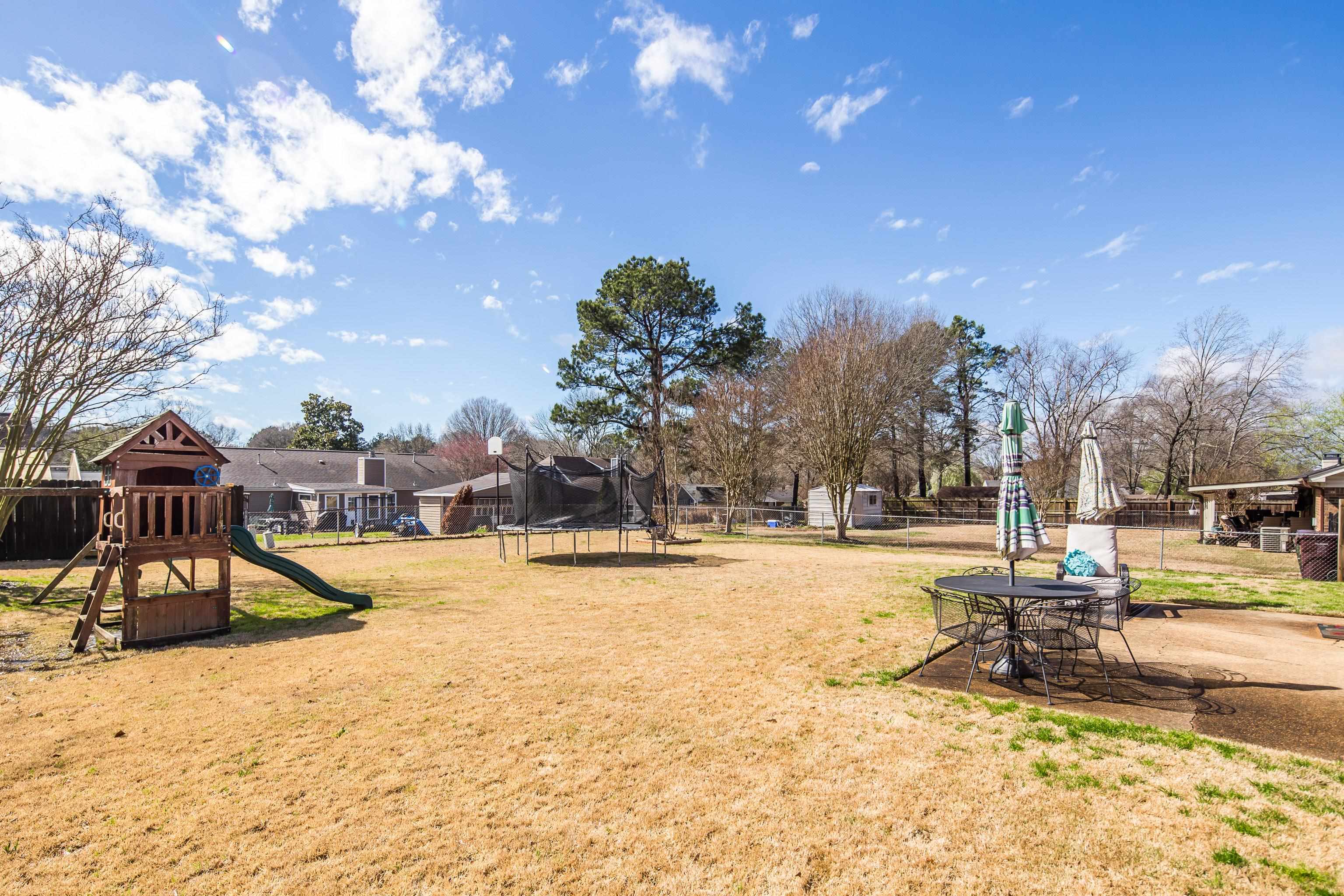 411 Shelton Road Collierville, TN 38017 - Photo 18 of 19 a view of a swimming pool with a yard