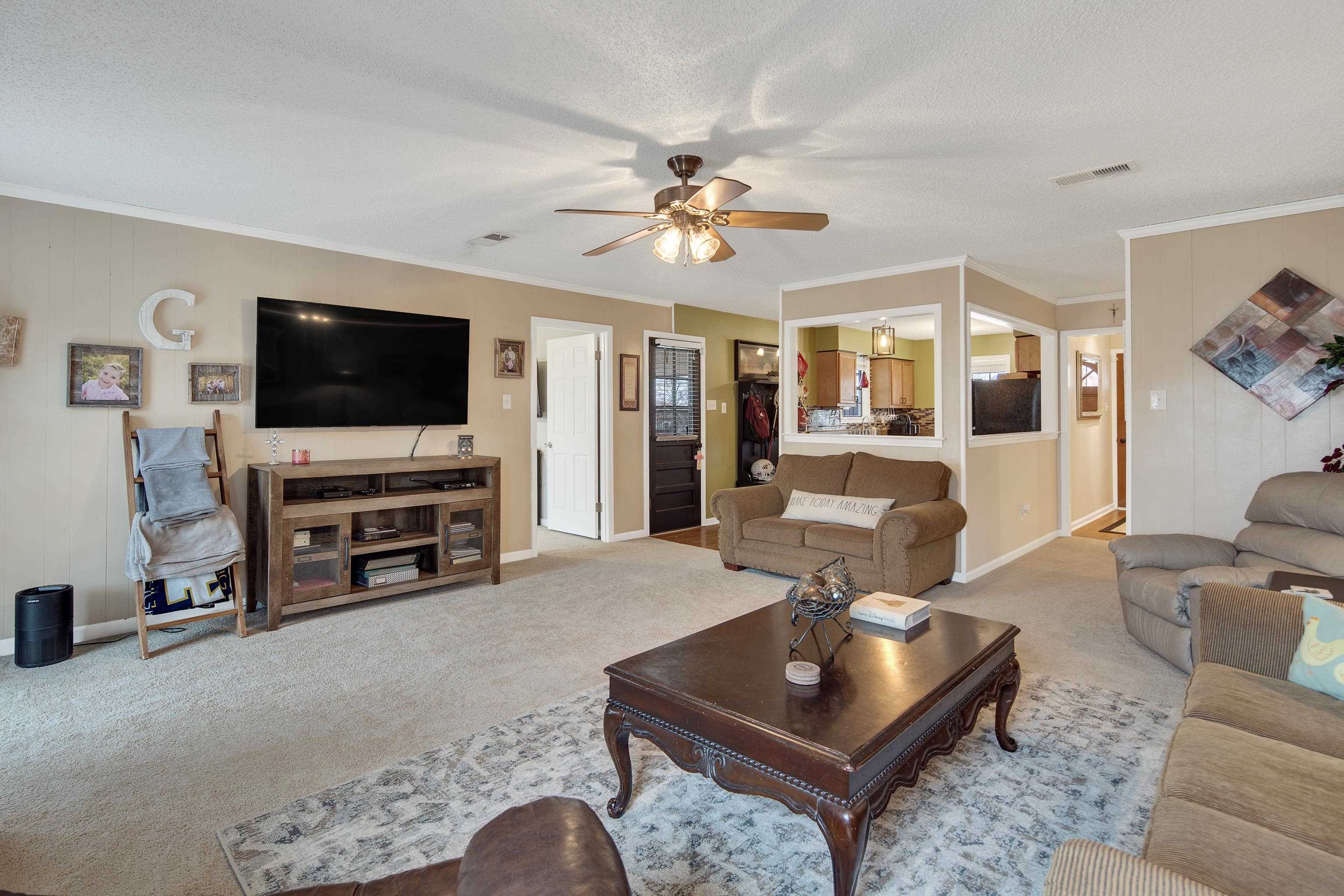 411 Shelton Road Collierville, TN 38017 - Photo 5 of 19 a living room with furniture and a flat screen tv