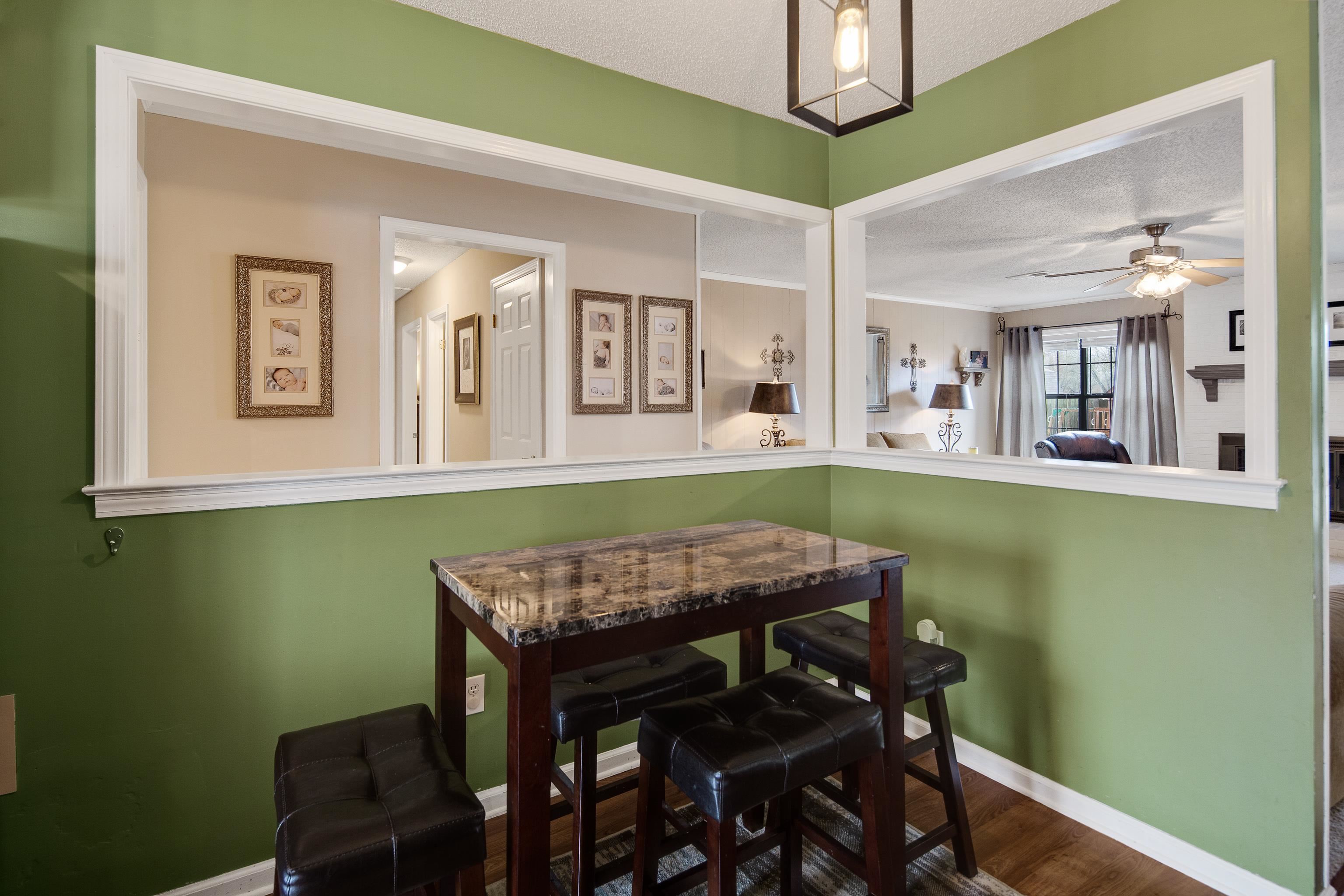 411 Shelton Road Collierville, TN 38017 - Photo 10 of 19 a view of a dining room with furniture and a potted plant
