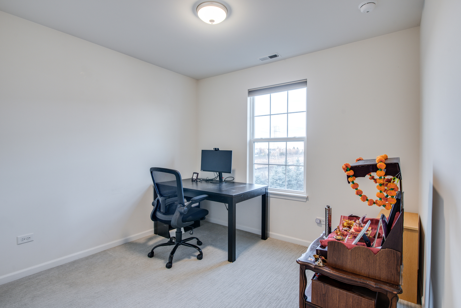 4477 Monroe Court Naperville, IL 60564 - Photo 18 of 23 a view of a workspace with furniture and a window