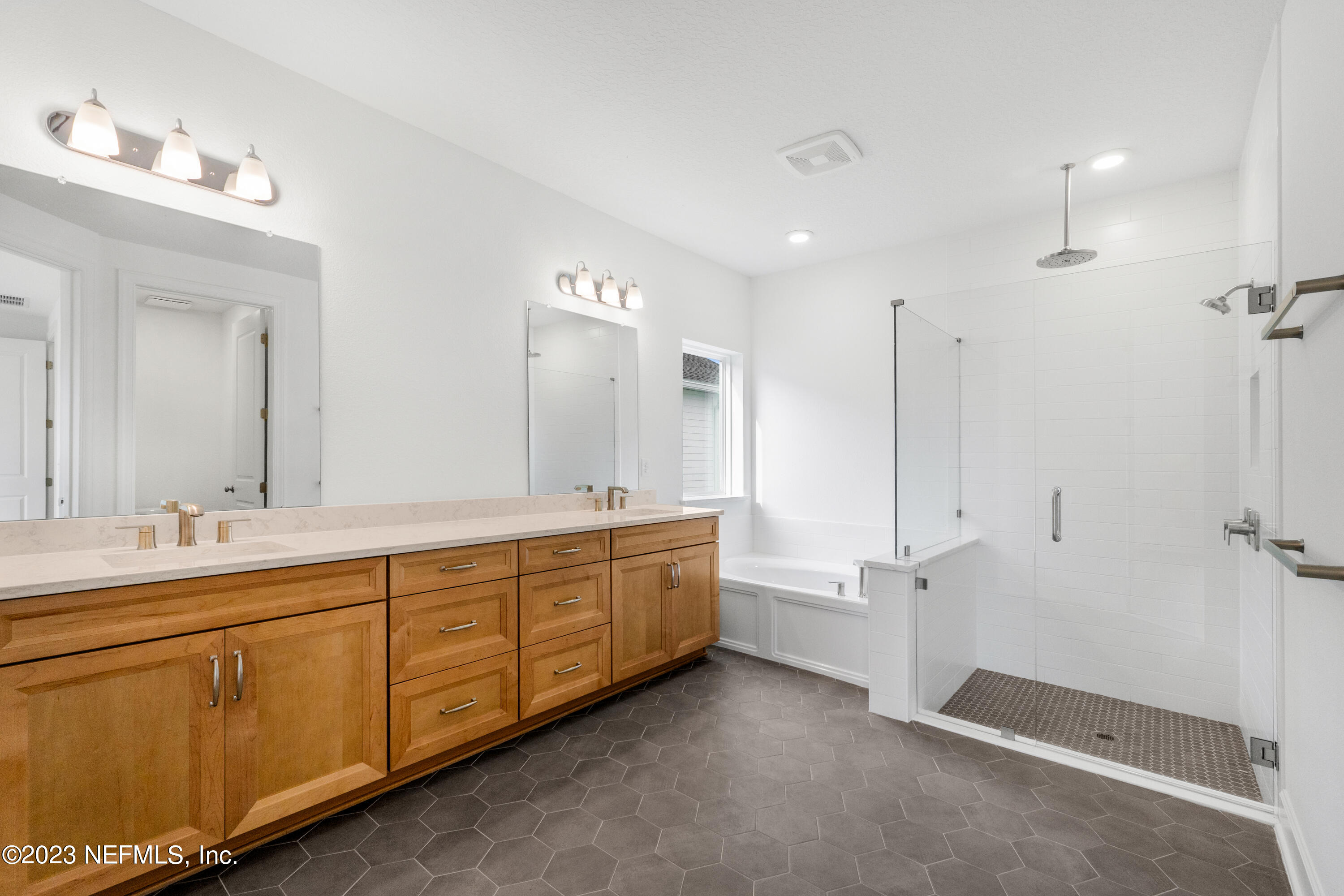 25 Shipman Court St. Augustine, FL 32092 - Photo 12 of 12 a spacious bathroom with double vanity and a mirror
