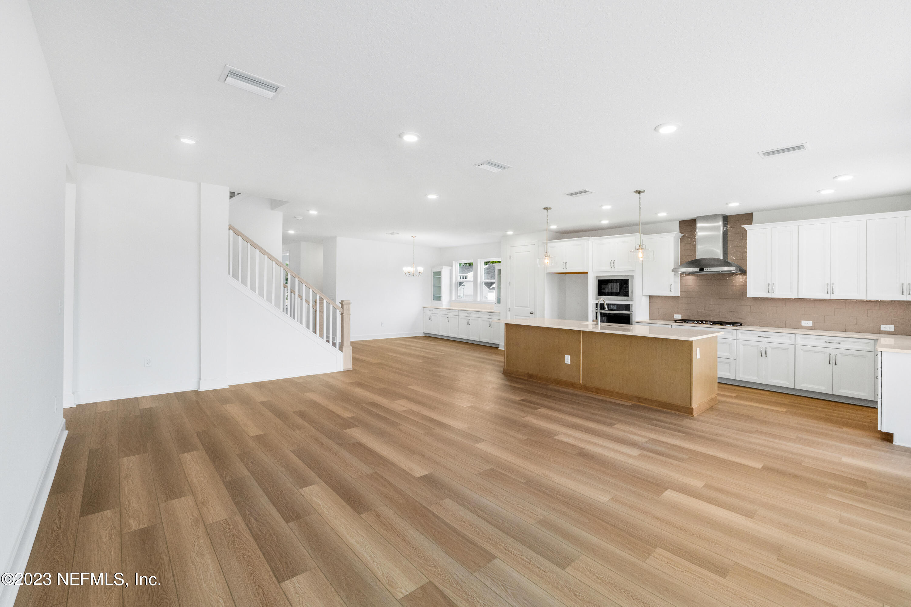 25 Shipman Court St. Augustine, FL 32092 - Photo 5 of 12 a large kitchen with stainless steel appliances kitchen island a large counter top and a stove top oven