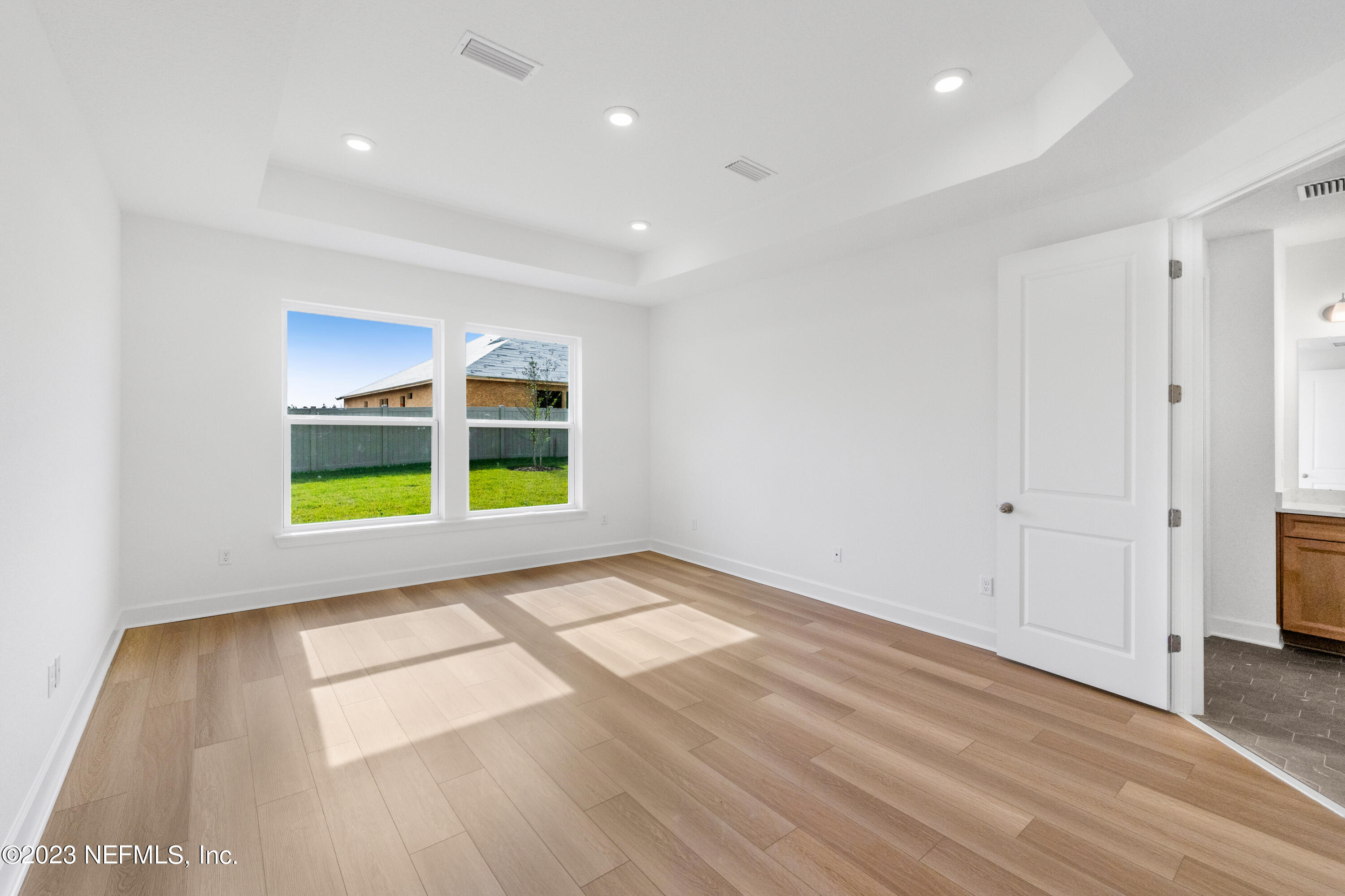 25 Shipman Court St. Augustine, FL 32092 - Photo 7 of 12 a view of an empty room with wooden floor and window