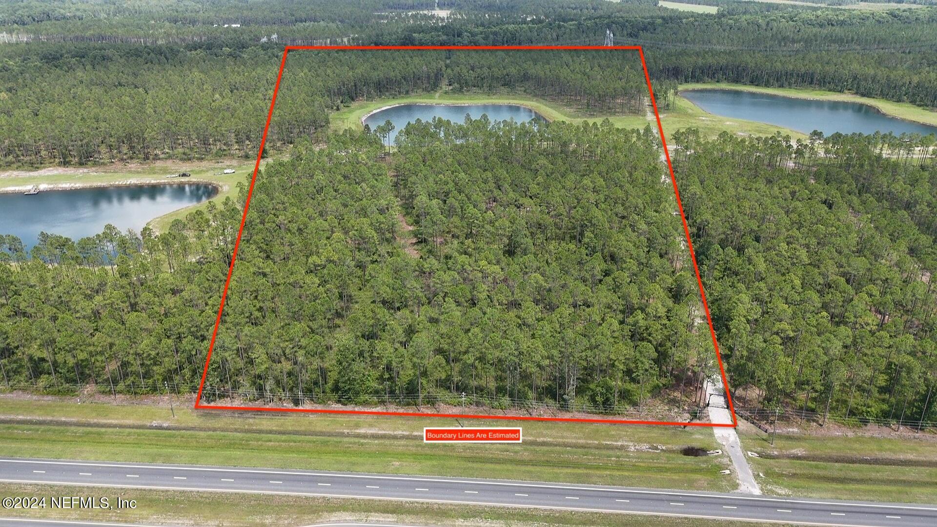 Lot 3 Us Highway Jacksonville, FL 32234 - Photo 8 of 8 a view of a water pond with green yard