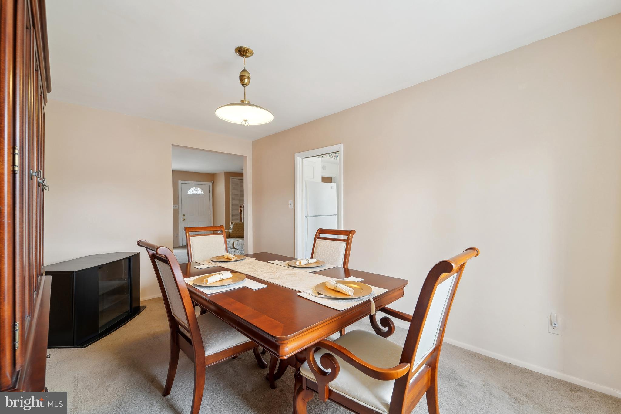 1100 Cedarcroft Road Baltimore, MD 21239 - Photo 11 of 34 a view of a dining room with furniture and wooden floor