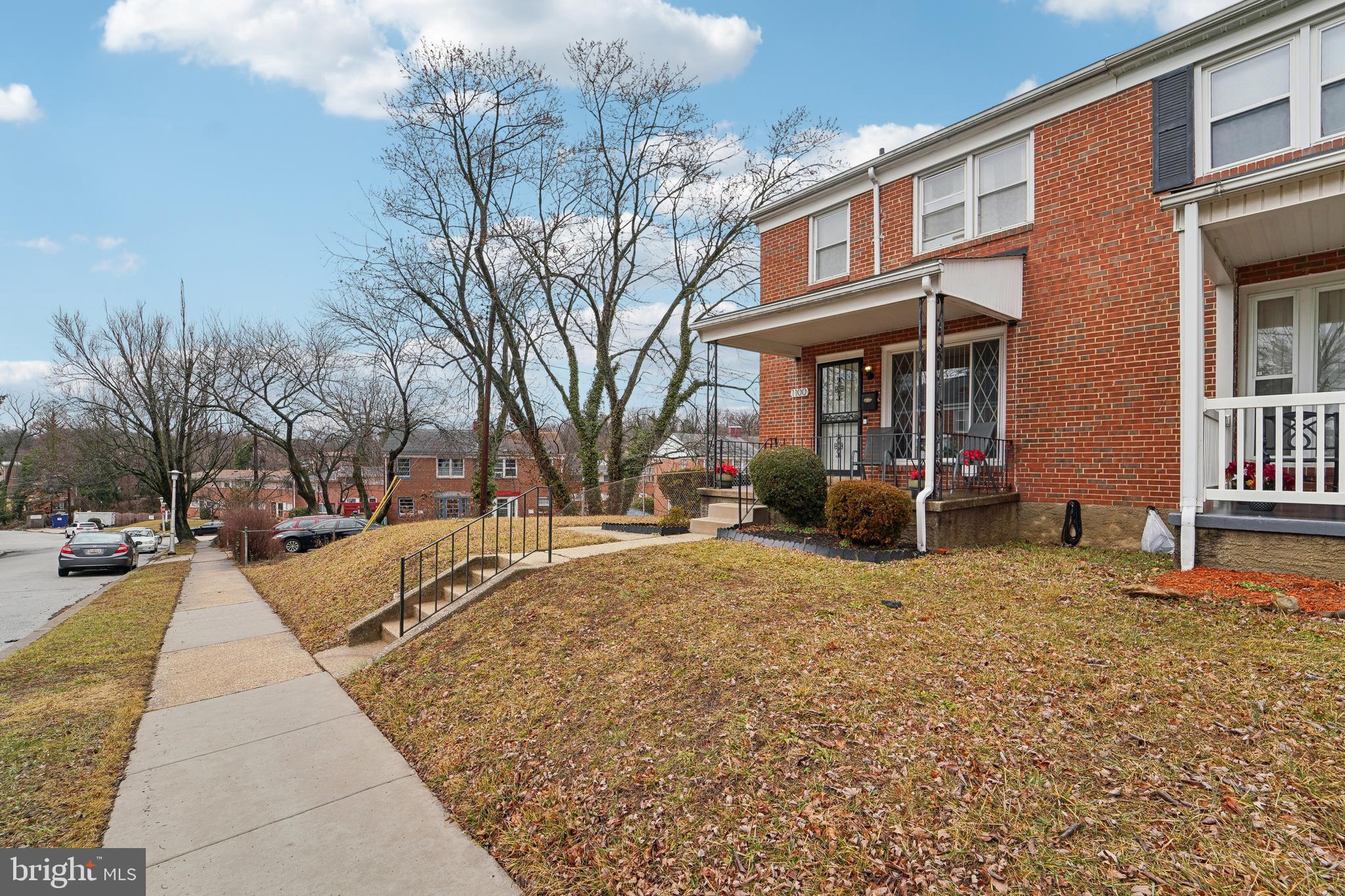 1100 Cedarcroft Road Baltimore, MD 21239 - Photo 3 of 34 a view of a house with a yard covered in snow