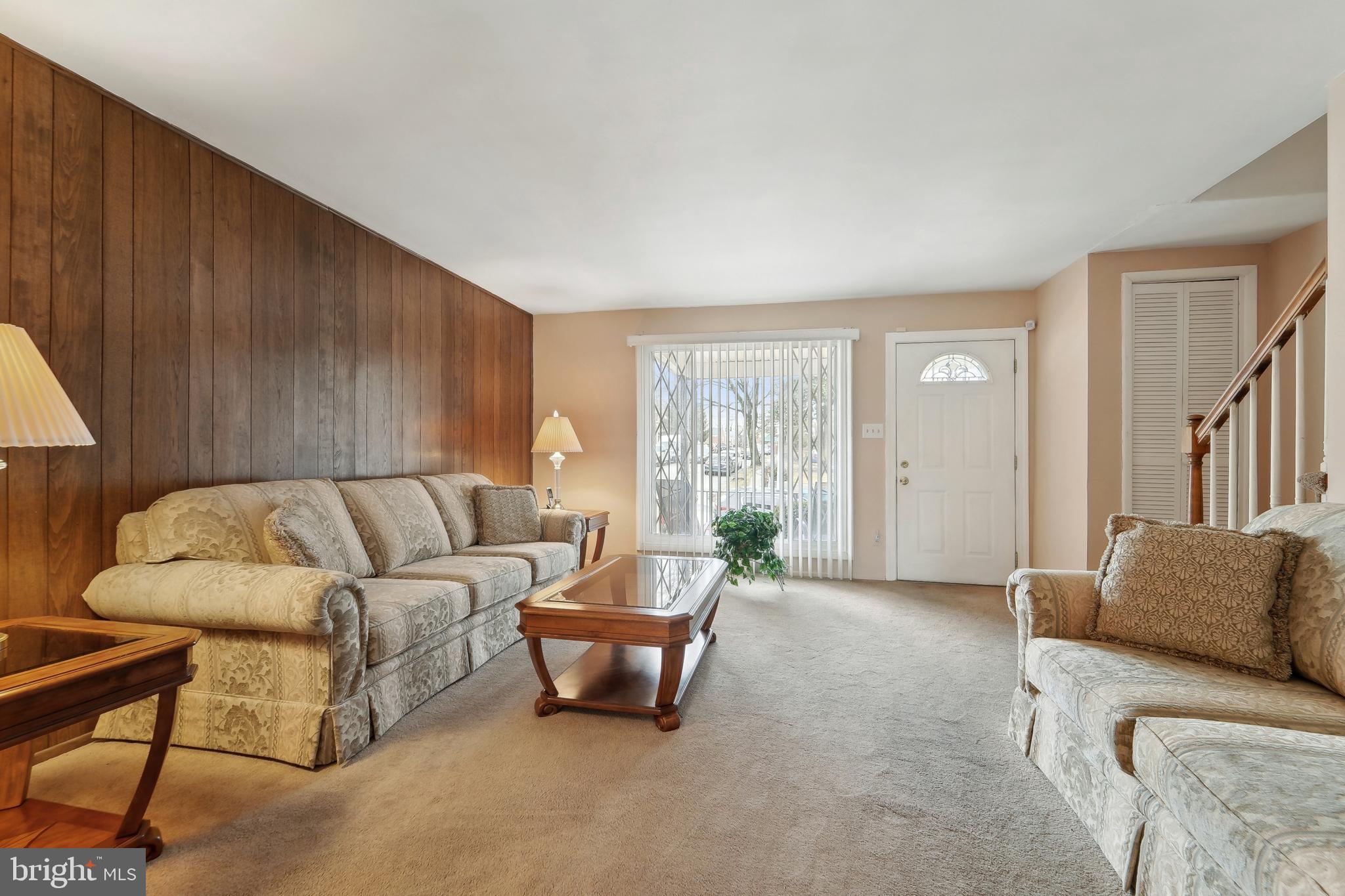 1100 Cedarcroft Road Baltimore, MD 21239 - Photo 7 of 34 a living room with furniture and a large window