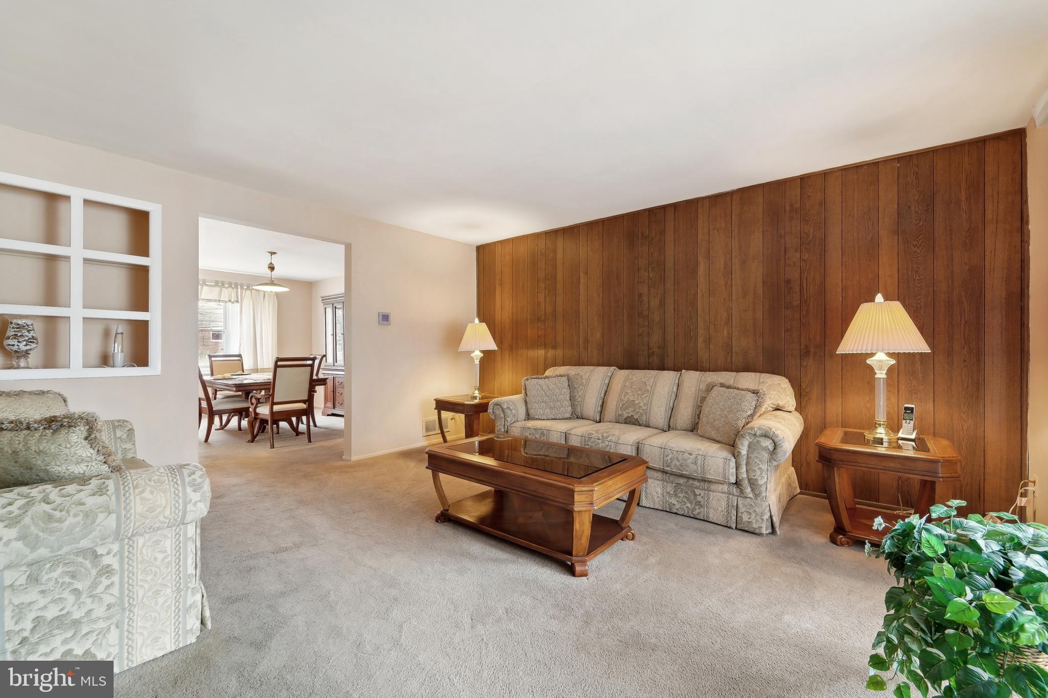 1100 Cedarcroft Road Baltimore, MD 21239 - Photo 9 of 34 a living room with furniture and a table